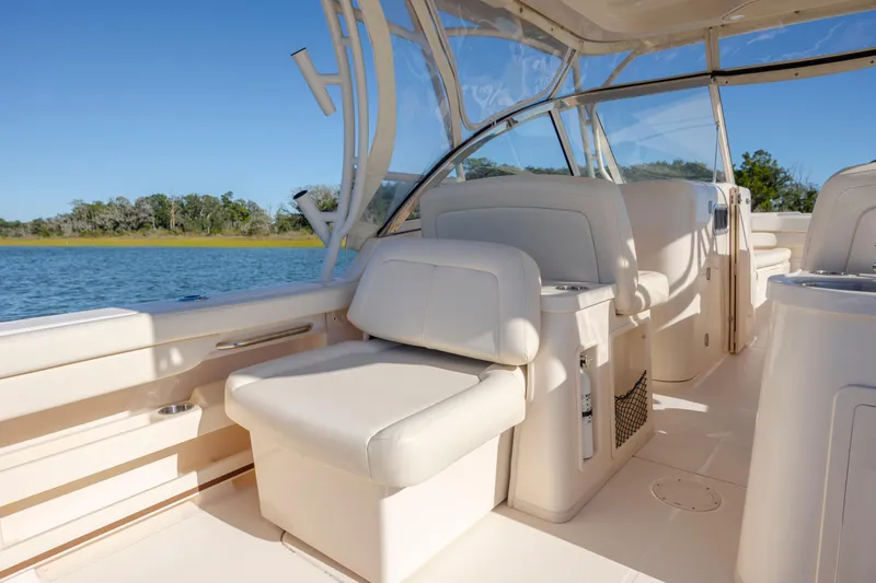 Slide: The Image of 2020 Grady-White Freedom 307 boat interior with comfortable seating and scenic water view. - 41