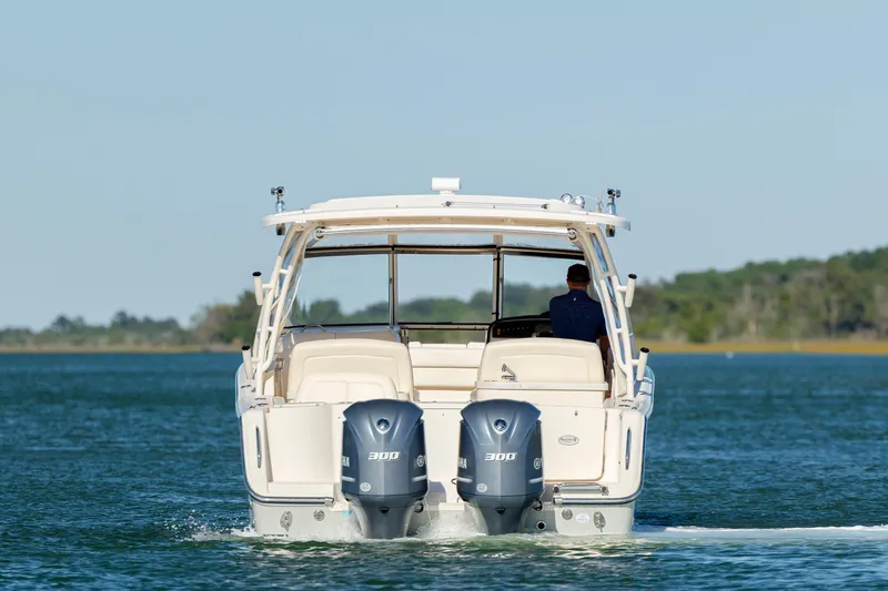 Slide: The Image of 2020 Grady-White Freedom 307 boat cruising on a calm lake. - 8