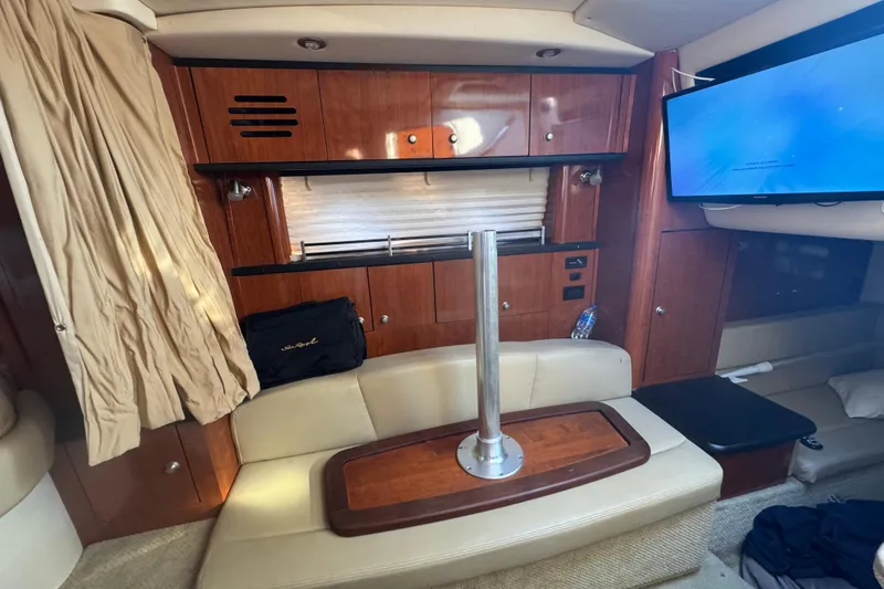 Slide: The Image of Interior of 2007 Sea Ray Sundancer 310 yacht with wood cabinetry and seating area. - 15
