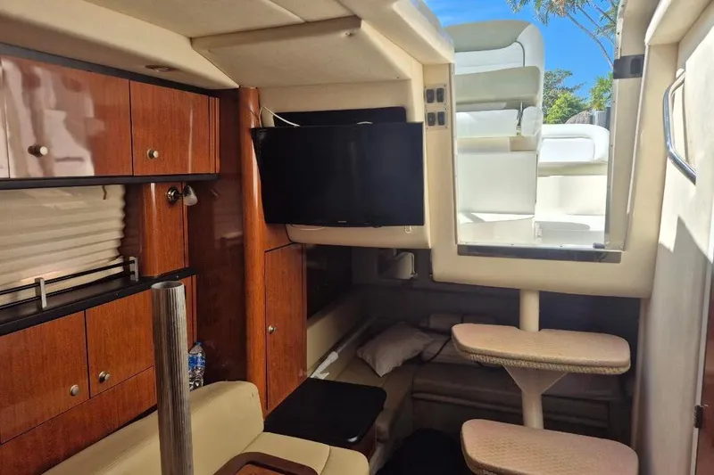 Slide: The Image of Interior of 2007 Sea Ray Sundancer 310 yacht with wooden cabinets and seating. - 23