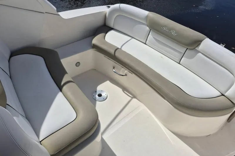 Slide: The Image of 2007 Sea Ray Sundancer 310 boat interior with white and beige seating. - 25