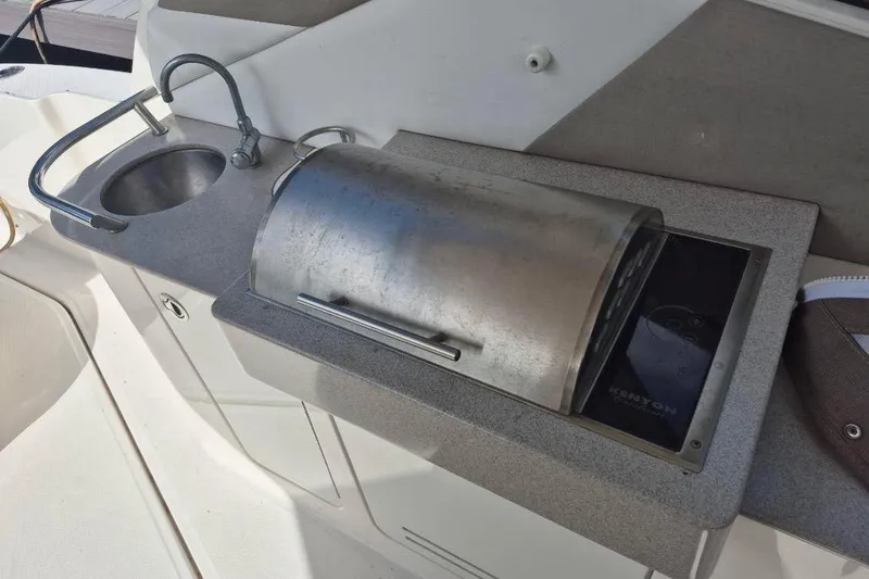 Slide: The Image of 2007 Sea Ray Sundancer 310 boat kitchenette with sink and grill. - 28