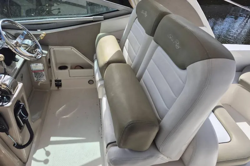 Slide: The Image of 2007 Sea Ray Sundancer 310 cockpit with dual seats and steering wheel. - 35