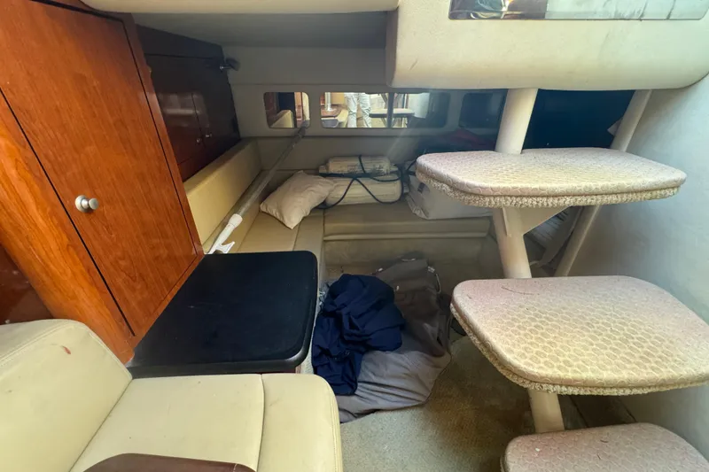 Slide: The Image of Interior of 2007 Sea Ray Sundancer 310 with seating, steps, and storage cabinet. - 47