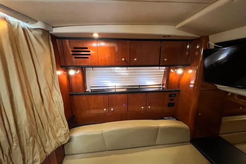 Slide: The Image of Luxurious interior of 2007 Sea Ray Sundancer 310 with wood cabinetry and modern lighting. - 60