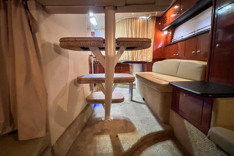 Slide: The Image of Interior of 2007 Sea Ray Sundancer 310 yacht with cozy seating and elegant wood finishes. - 66