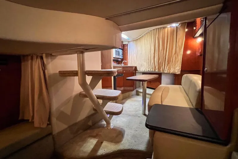 Slide: The Image of Interior of 2007 Sea Ray Sundancer 310 yacht with cozy seating and kitchenette. - 67
