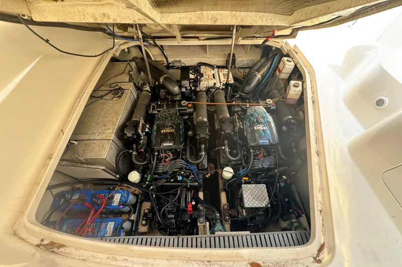 Slide: The Image of Engine compartment of a 2007 Sea Ray Sundancer 310, showcasing dual engines and components. - 71