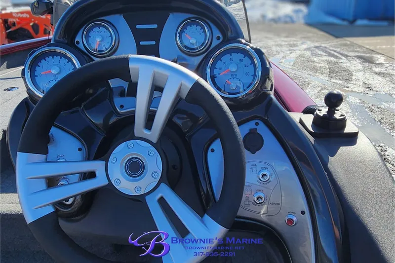 Slide: The Image of 2019 Tracker Pro Team 175 TXW boat dashboard with steering wheel and gauges. - 6