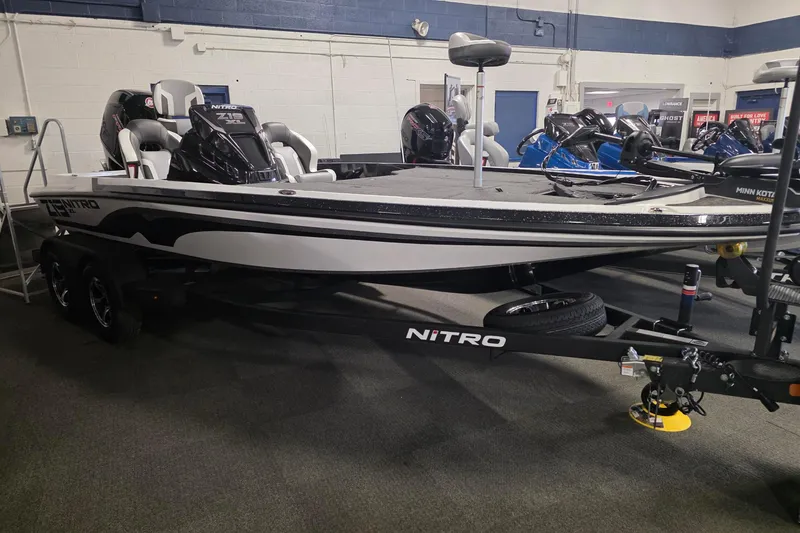 The Image of 2026 Nitro Z19 XL boat on display in showroom, featuring sleek design and modern equipment. - 0