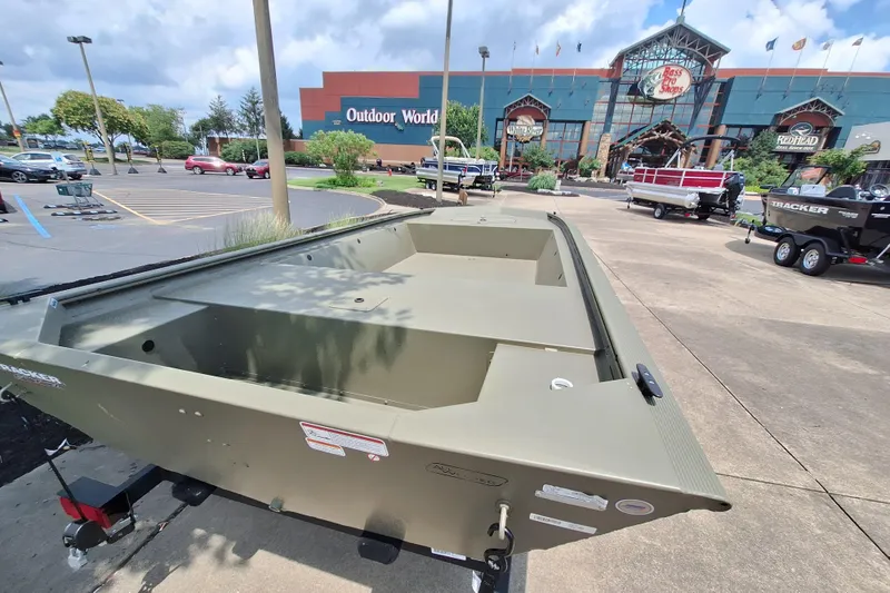Slide: The Image of 2026 Tracker Grizzly 1648 Utility boat displayed outside Bass Pro Shops. - 3