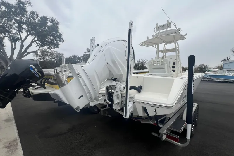 Slide: The Image of 2025 Pathfinder 2700 Open boat with dual outboard motors on a trailer. - 3