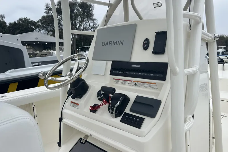 Slide: The Image of 2025 Pathfinder 2700 Open boat console with Garmin navigation system and steering wheel. - 5