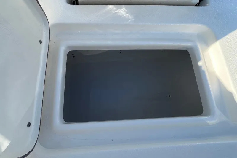 Slide: The Image of Storage compartment of 2026 Bulls Bay 2200 boat, open and empty. - 15