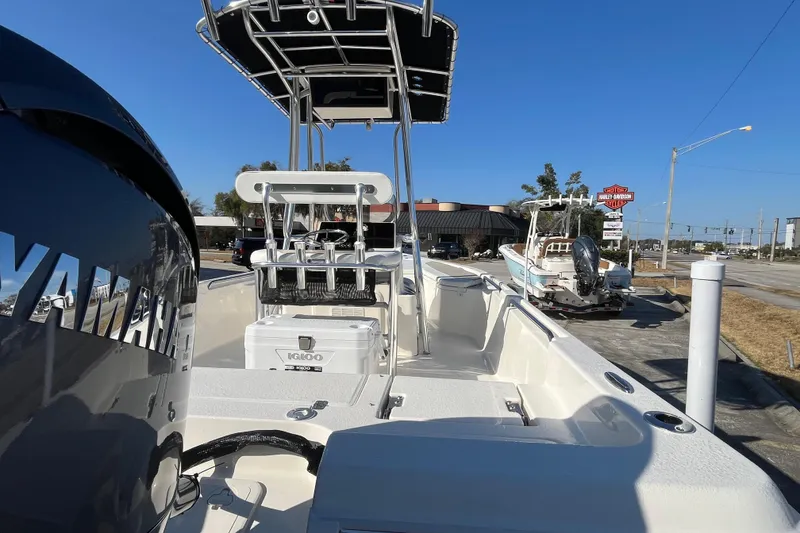 Slide: The Image of 2026 Bulls Bay 2200 boat with Yamaha engine, parked outdoors under clear blue sky. - 8