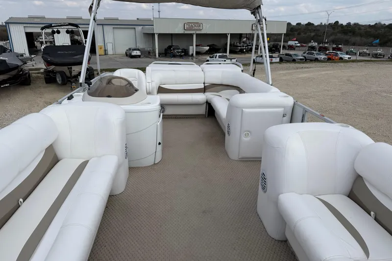 Slide: The Image of 2006 Crest II LE 2270 pontoon boat with spacious white seating and canopy. - 6