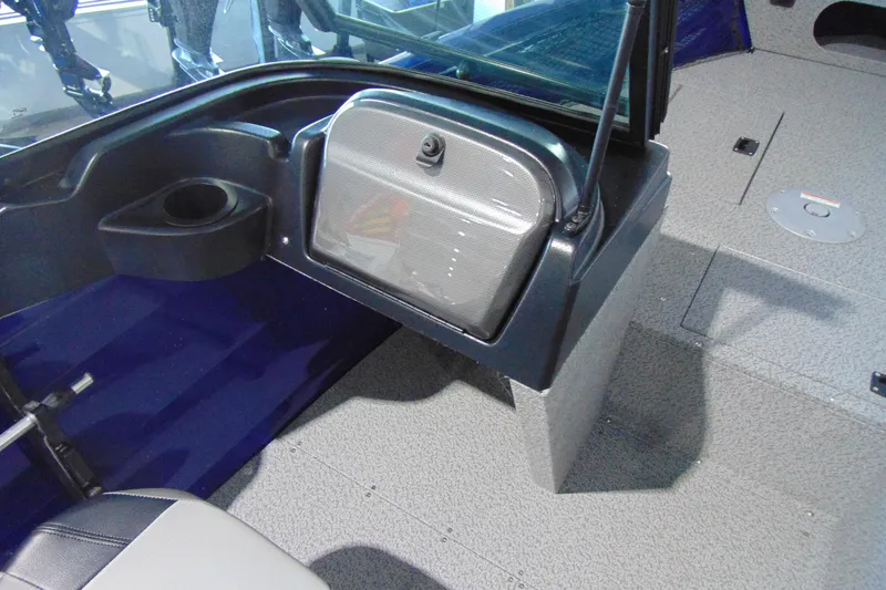 Slide: The Image of 2026 Crestliner 1850 Kodiak WT interior with storage compartment and cup holder. - 10