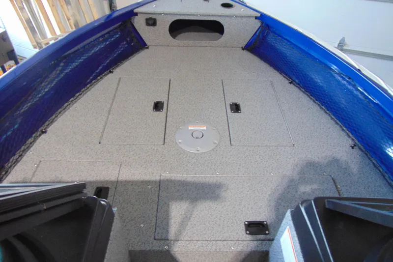 Slide: The Image of 2026 Crestliner 1850 Kodiak WT boat interior with spacious deck and storage compartments. - 11