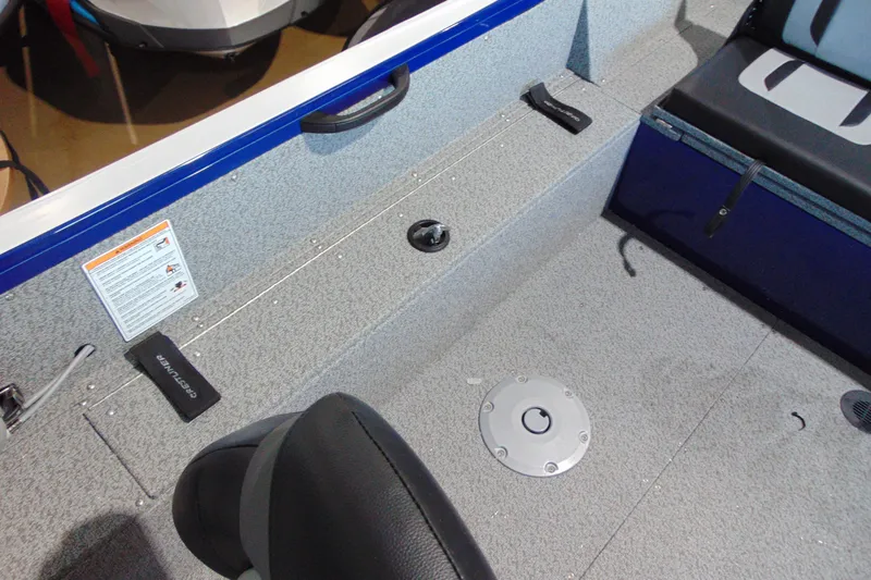 Slide: The Image of Interior of 2026 Crestliner 1850 Kodiak WT boat, featuring seating and storage compartments. - 18