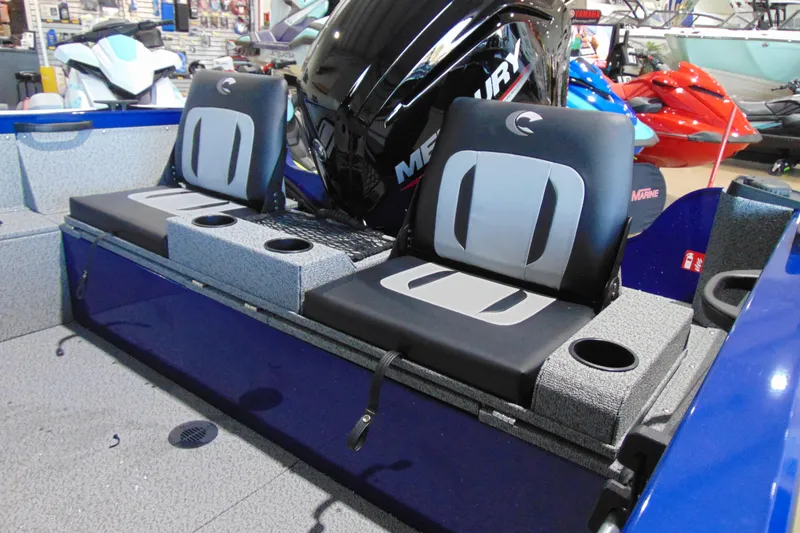 Slide: The Image of 2026 Crestliner 1850 Kodiak WT boat interior with seating and Mercury engine. - 5