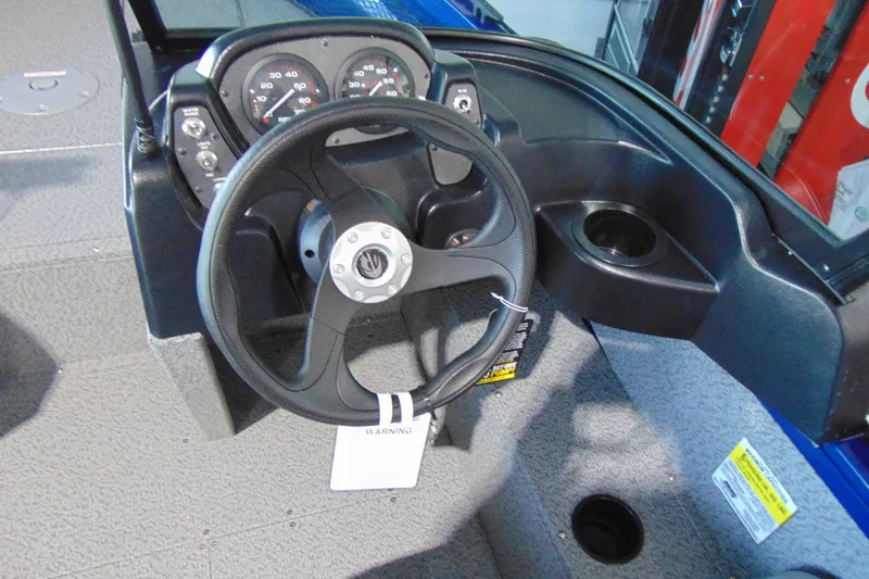 Slide: The Image of 2026 Crestliner 1850 Kodiak WT boat dashboard with steering wheel and gauges. - 9