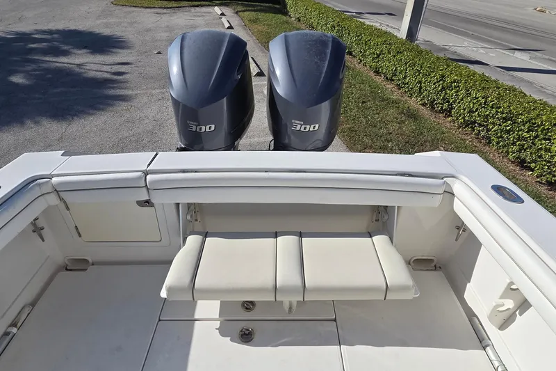 Slide: The Image of 2015 Jupiter 30 FS boat with twin 300 horsepower engines, rear seating view. - 10