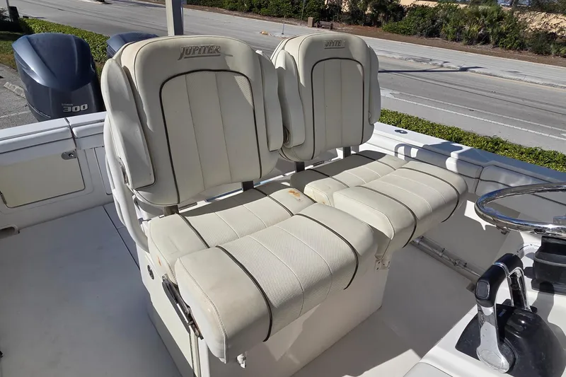 Slide: The Image of 2015 Jupiter 30 FS boat with dual cushioned seats and Yamaha 300 engine. - 11