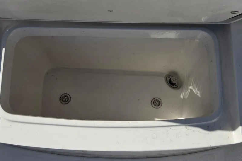 Slide: The Image of Empty storage compartment on a 2015 Jupiter 30 FS boat. - 15