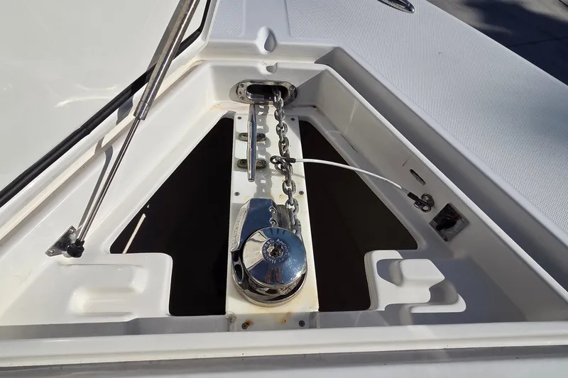 Slide: The Image of Anchor windlass system on a 2015 Jupiter 30 FS boat deck. - 18