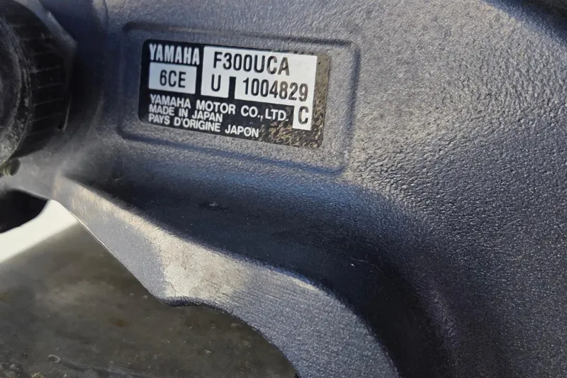 Slide: The Image of Close-up of Yamaha F300UCA engine label on a 2015 Jupiter 30 FS boat. - 25