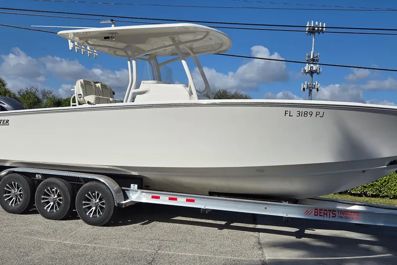 Slide: The Image of 2015 Jupiter 30 FS boat on trailer, sunny day, clear sky background. - 3
