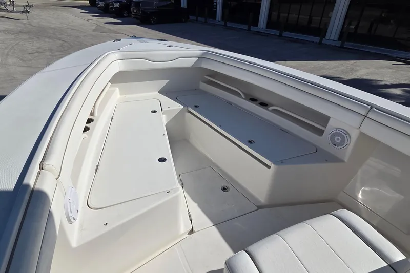 Slide: The Image of 2015 Jupiter 30 FS boat interior with seating and storage compartments. - 4