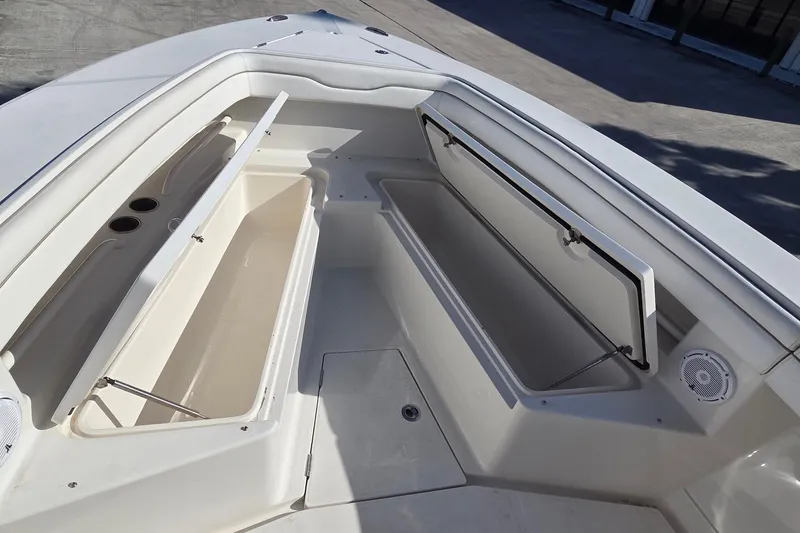 Slide: The Image of 2015 Jupiter 30 FS boat storage compartments open on deck. - 6
