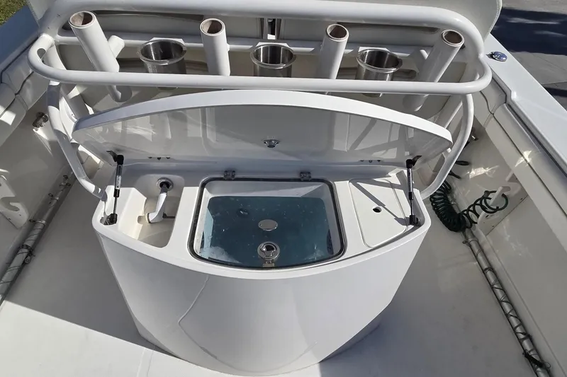 Slide: The Image of 2015 Jupiter 30 FS boat with open livewell and rod holders. - 9