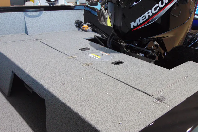 Slide: The Image of 2026 Crestliner 1850 Kodiak WT boat interior with Mercury engine, featuring durable flooring. - 11