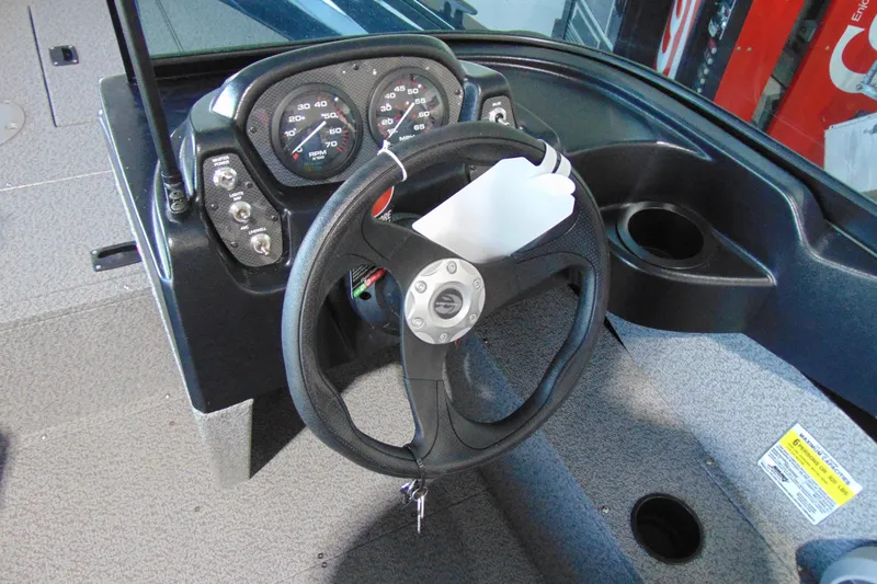 Slide: The Image of Steering console of 2026 Crestliner 1850 Kodiak WT boat with gauges and controls. - 14