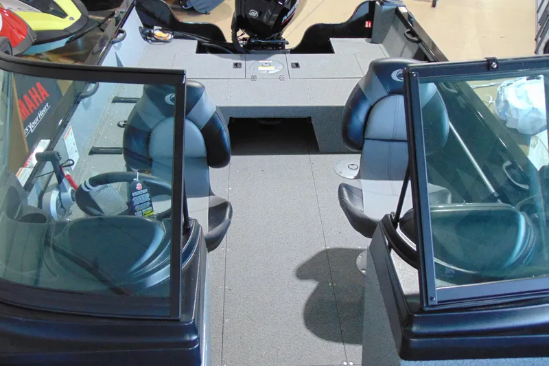 Slide: The Image of 2026 Crestliner 1850 Kodiak WT boat interior with seating and console view. - 17