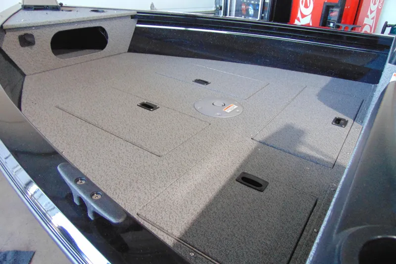 Slide: The Image of 2026 Crestliner 1850 Kodiak WT boat interior with spacious deck and storage compartments. - 5