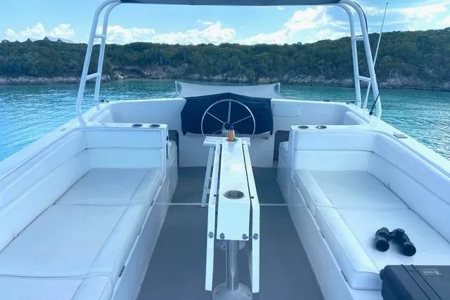 Slide: The Image of 2008 Great Harbour N37 boat interior with seating, table, and scenic water view. - 11