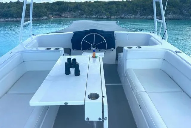 Slide: The Image of 2008 Great Harbour N37 yacht interior with seating, table, and scenic water view. - 12