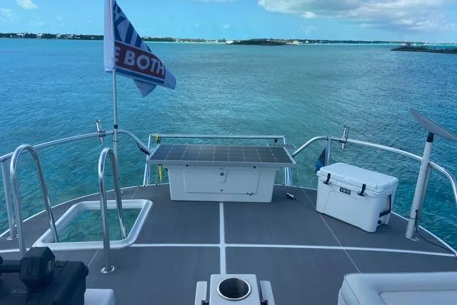 Slide: The Image of 2008 Great Harbour N37 yacht deck with solar panel, cooler, and ocean view. - 13