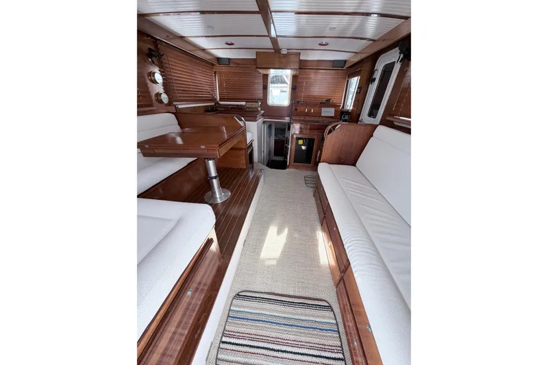 Slide: The Image of Interior of 2008 Great Harbour N37 yacht with wooden finishes and white seating. - 23