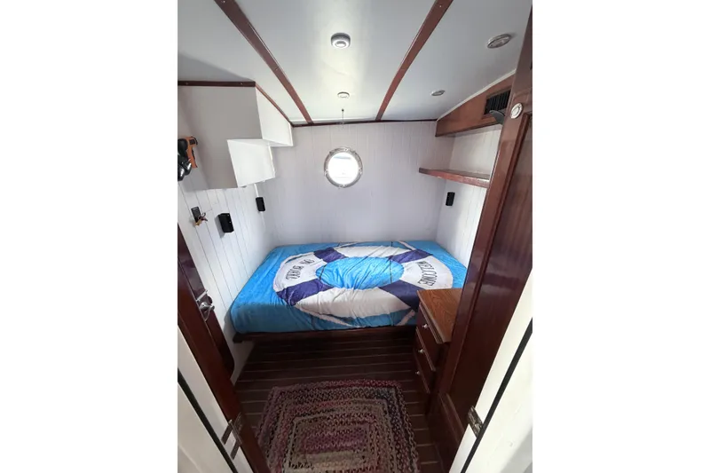 Slide: The Image of Cozy cabin interior of 2008 Great Harbour N37 boat with nautical-themed bedding. - 26