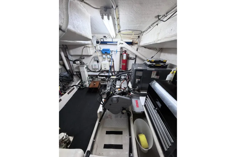 Slide: The Image of Engine room of 2008 Great Harbour N37 boat, featuring equipment and storage. - 29