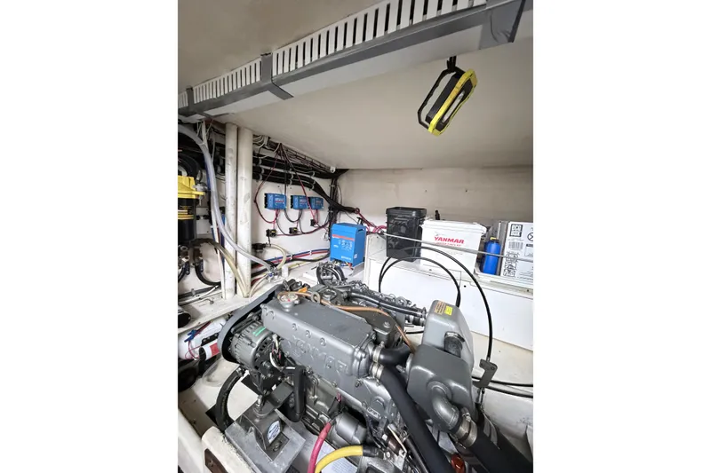Slide: The Image of Engine room of 2008 Great Harbour N37 boat with visible machinery and wiring. - 31