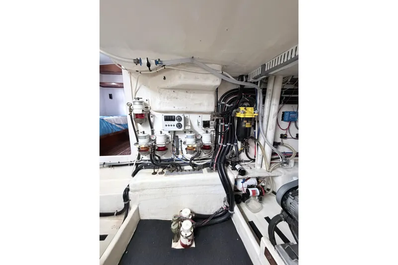 Slide: The Image of Engine room of 2008 Great Harbour N37 boat, showcasing fuel filters and wiring. - 32