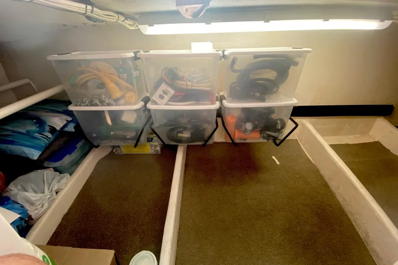 Slide: The Image of Storage area in a 2008 Great Harbour N37 boat with organized plastic bins. - 6