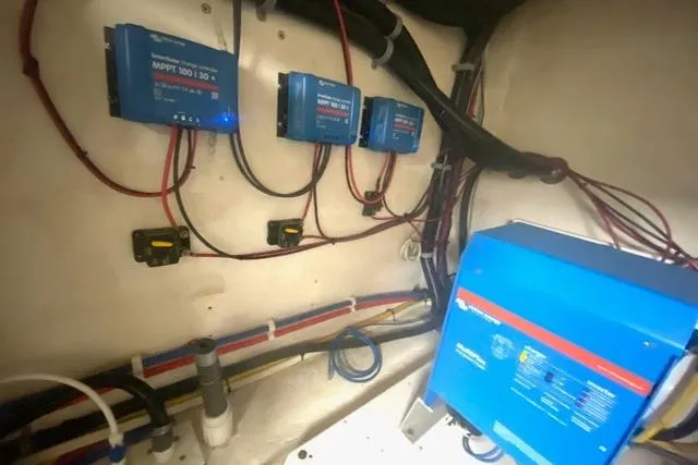 Slide: The Image of Electrical system setup in a 2008 Great Harbour N37 boat, featuring multiple blue control units. - 9