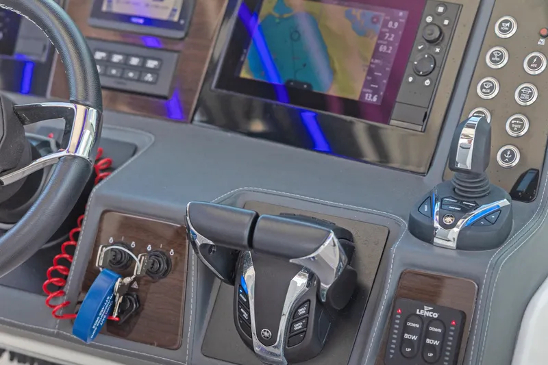 Slide: The Image of Cockpit controls of 2022 Chaparral 300 OSX boat with advanced navigation system. - 4