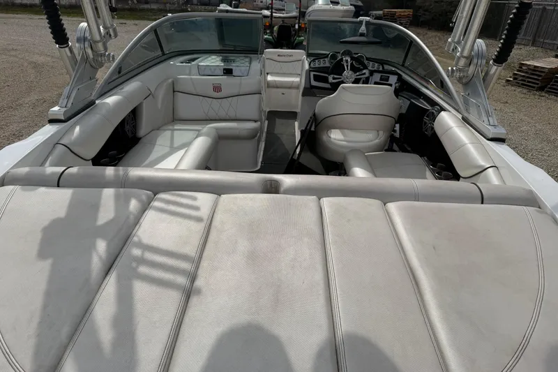 Slide: The Image of 2012 MasterCraft X2 boat interior with white leather seating and modern dashboard. - 8